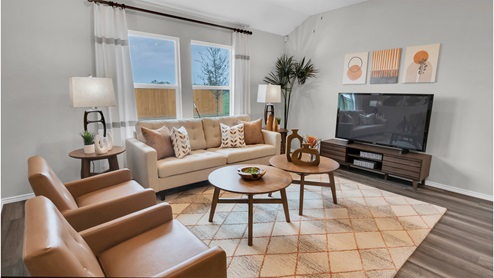 Eastern Wells Model Home living room with windows offering natural light.
