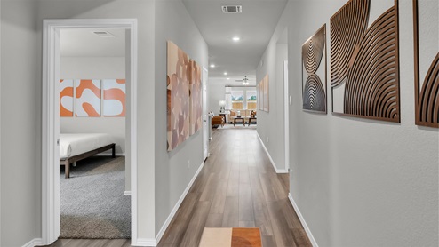 Eastern Wells Model Home entry hallway into secondary bedrooms.