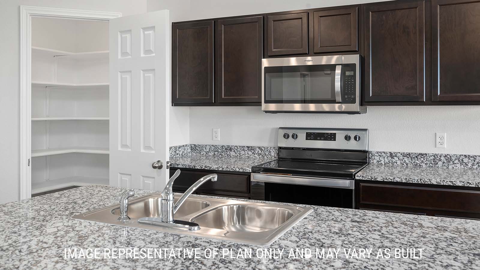 Bellvue kitchen with granite countertops and dark cabinets.