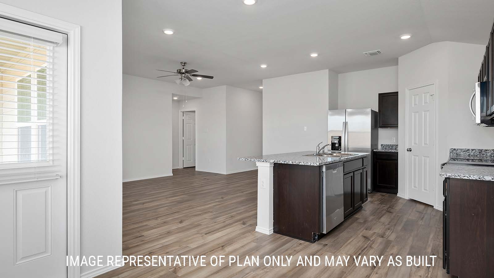 Bellvue dining room with view of the kitchen with a center kitchen island.