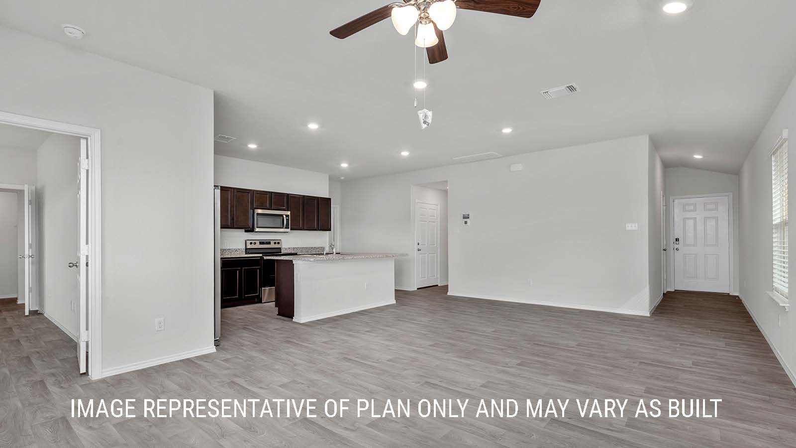 Camden living room with vinyl plank flooring and view of the entry way.