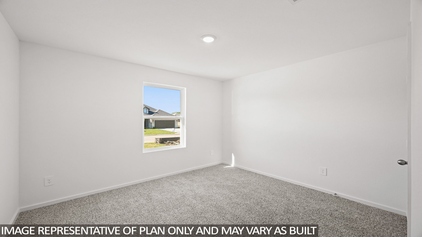 Archer secondary bedroom with carpeted flooring and widnow for natural lighting.