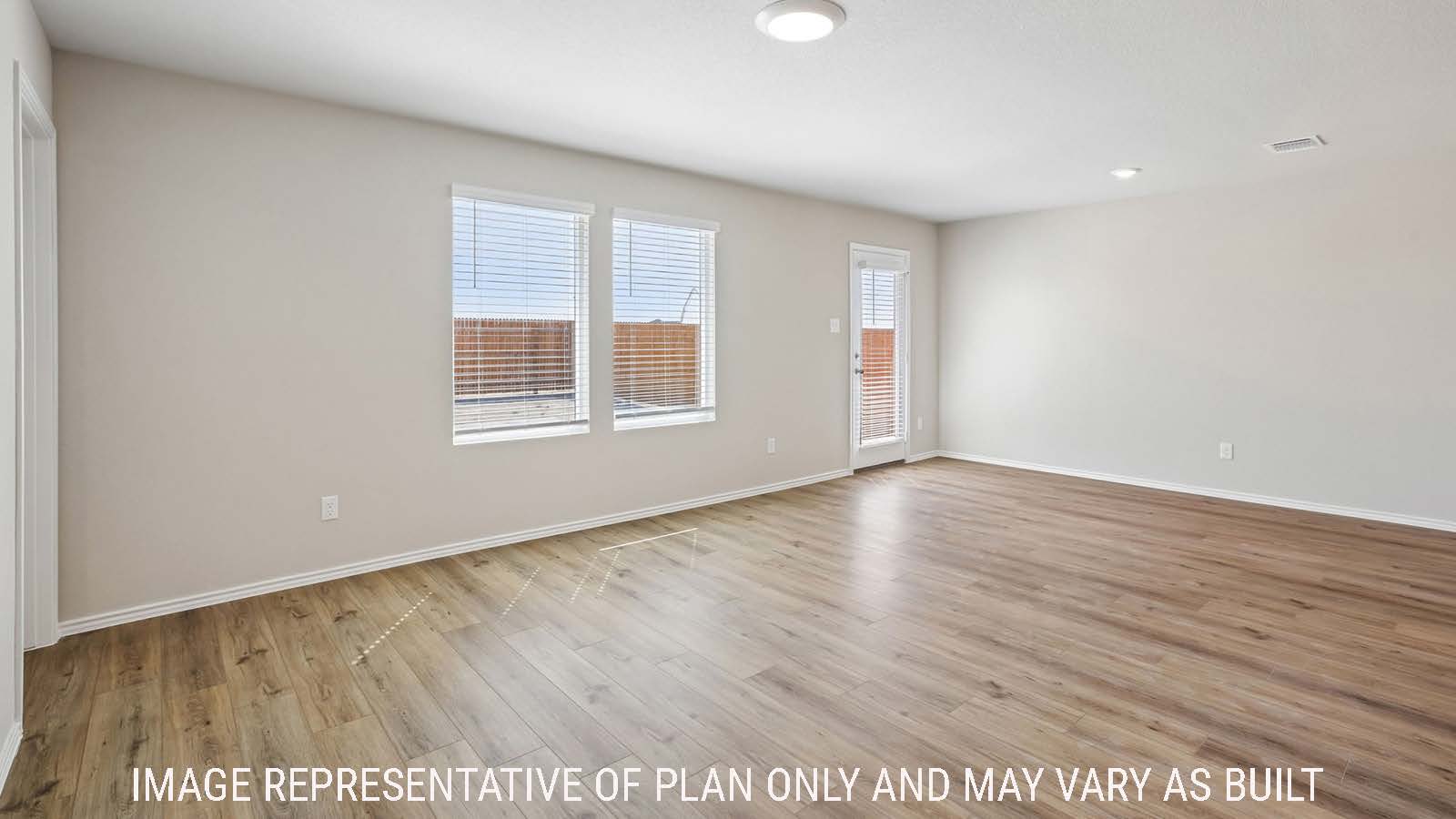 Archer living room with view of open concept dining room with windows for natural lighting.