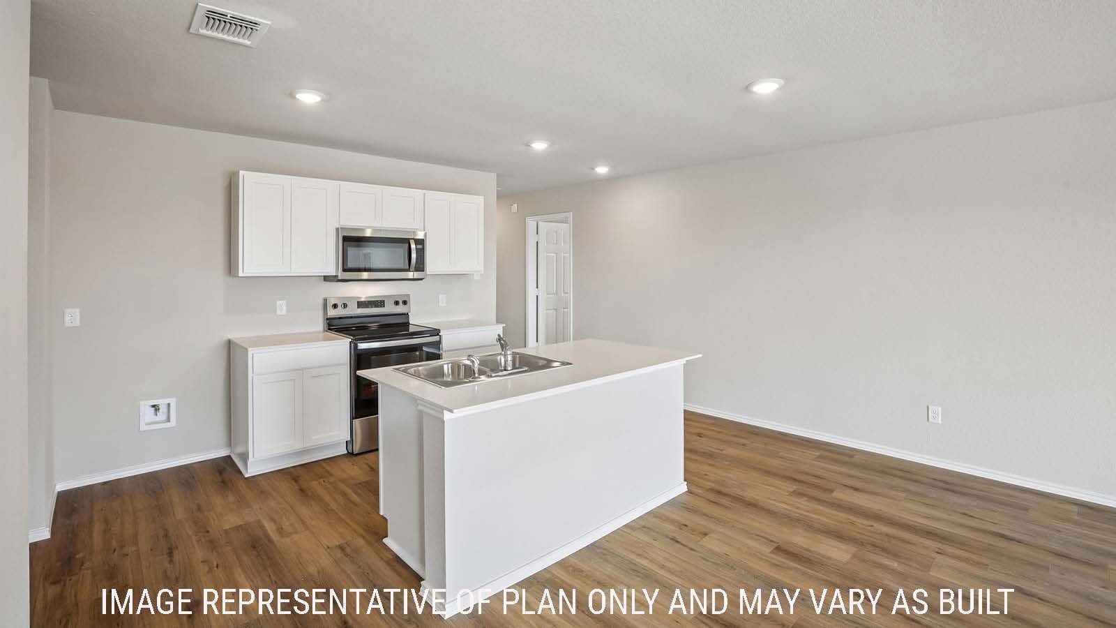 Archer kitchen with kitchen island with light cabinets and granite countertops.