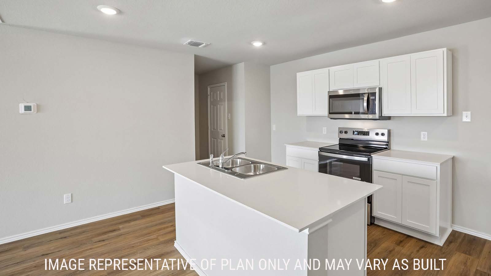 Archer kitchen with kitchen island with light cabinets and granite countertops.
