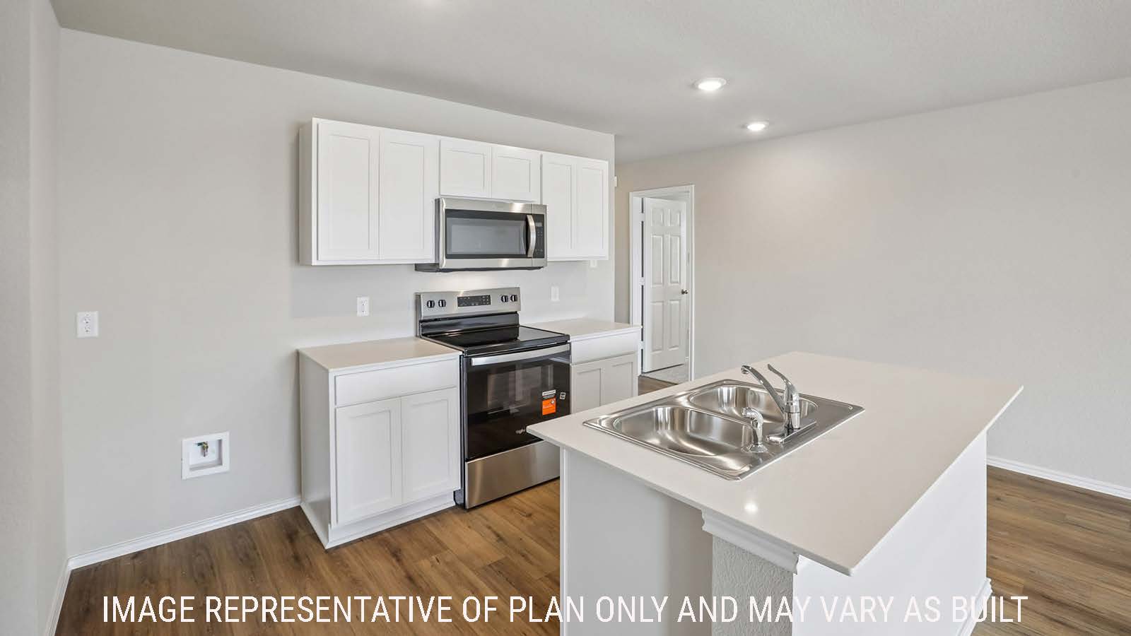Archer kitchen with kitchen island with light cabinets and granite countertops.