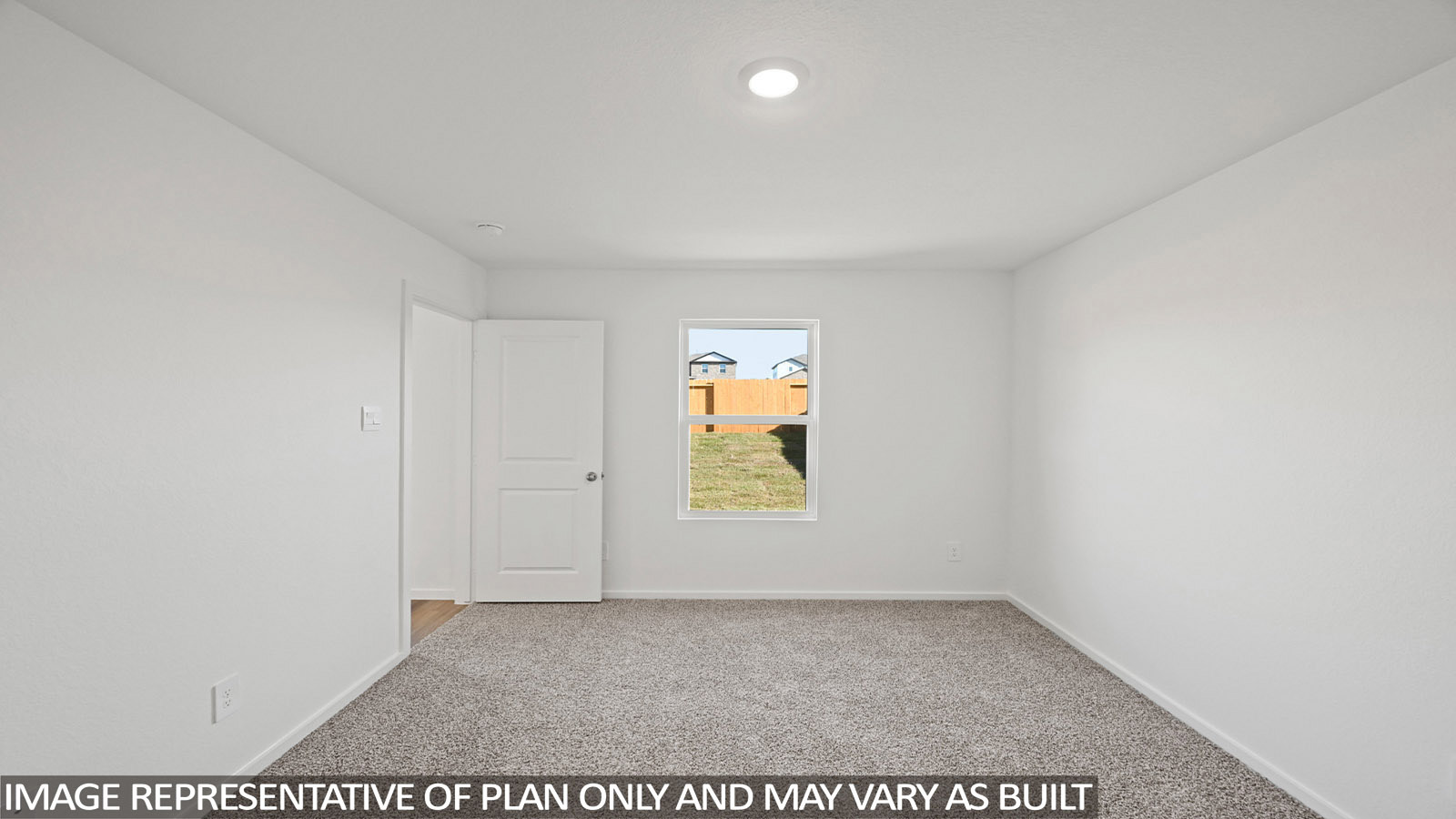 Bradley primary bedroom with carpeted flooring and window with natural lighting.