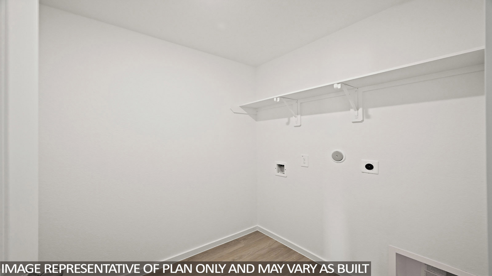 Bradley utility room with washer and dryer connections and shelving for storage.