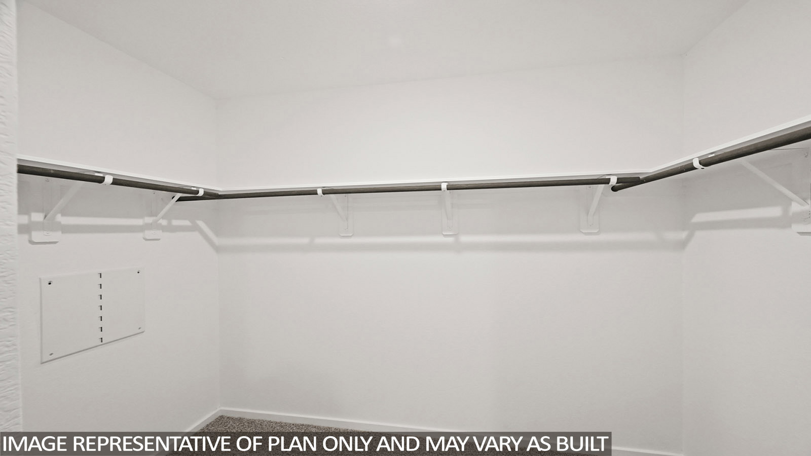 Bradley primary bedroom closet with carpeted flooring and shelving for storage.