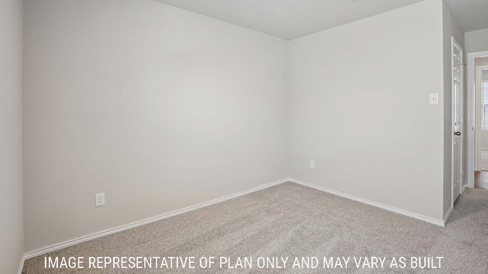 Bradley secondary bedroom with carpeted flooring and view of hallway.