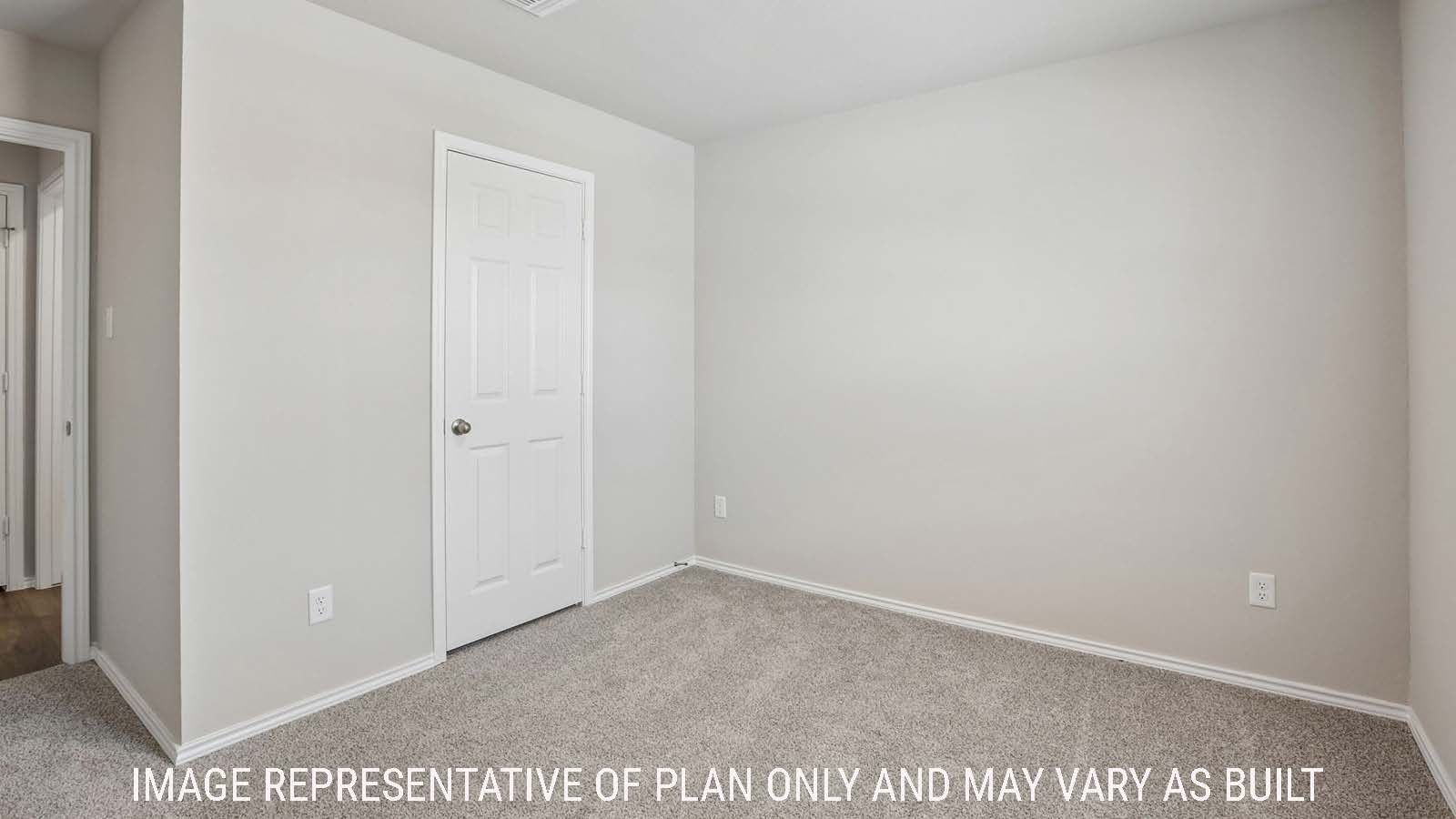 Bradley secondary bedroom with carpeted flooring and view of hallway.