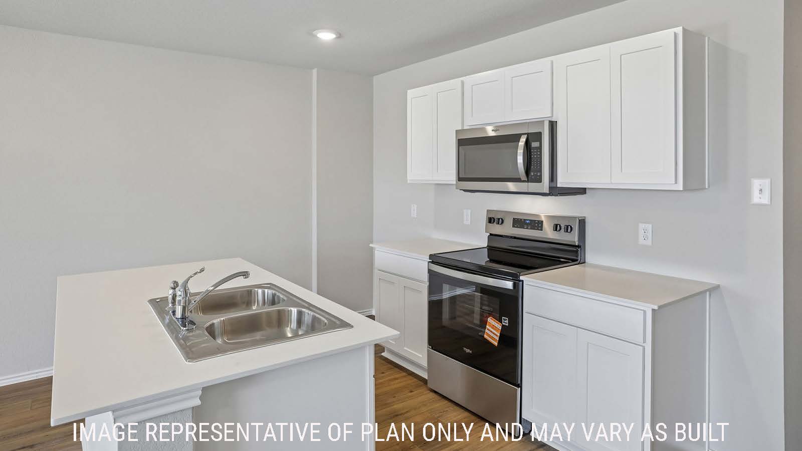 Bradley kitchen with kitchen island and white cabinets and granite countertops.