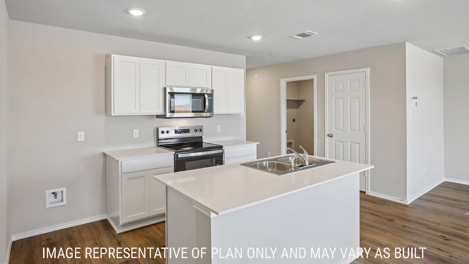 Bradley kitchen with kitchen island and white cabinets and granite countertops.