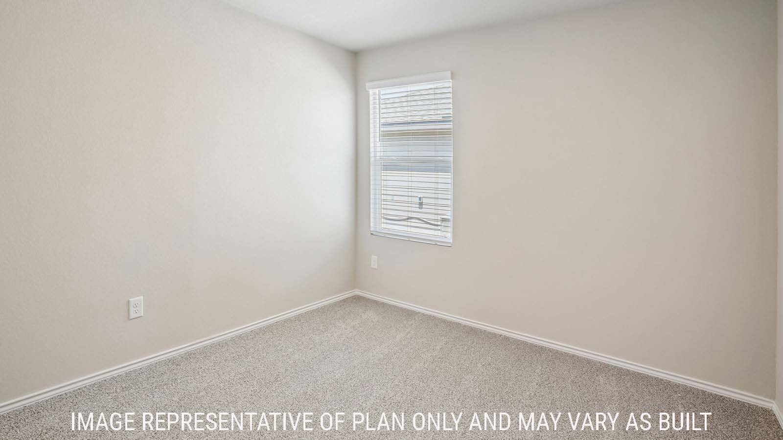 Bradley secondary bedroom with carpeted flooring and window for natural lighting.