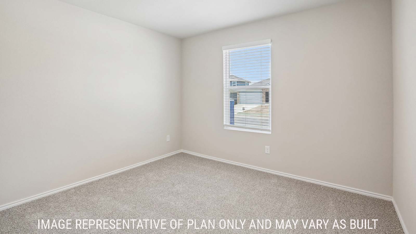Bradley secondary bedroom with carpeted flooring and window for natural lighting.