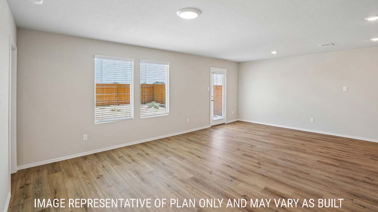 Bradley living room with windows for natural lighting and view of open concept dining room.