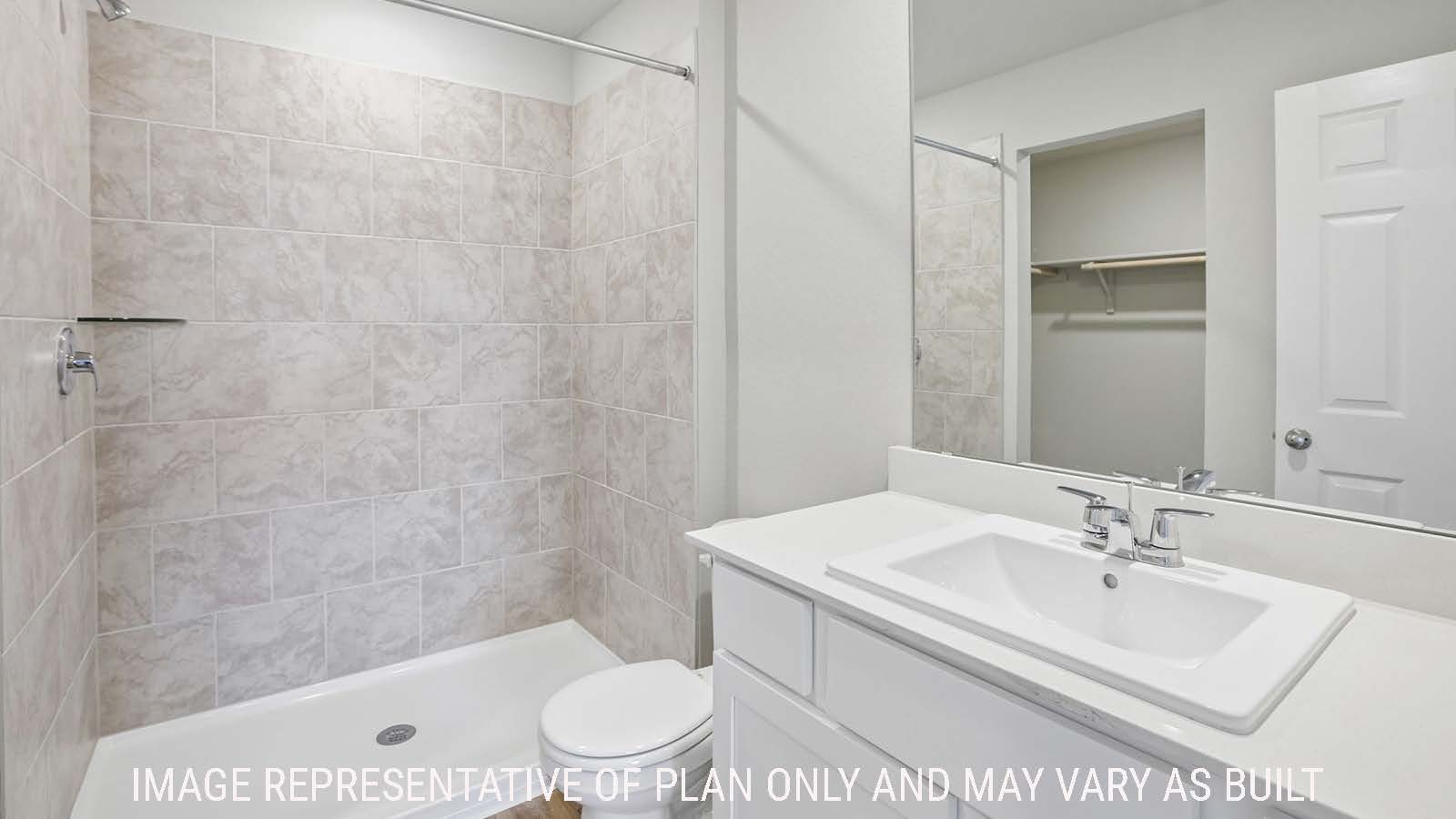 Bradley primary bathroom with vanity sink and walk-in shower.