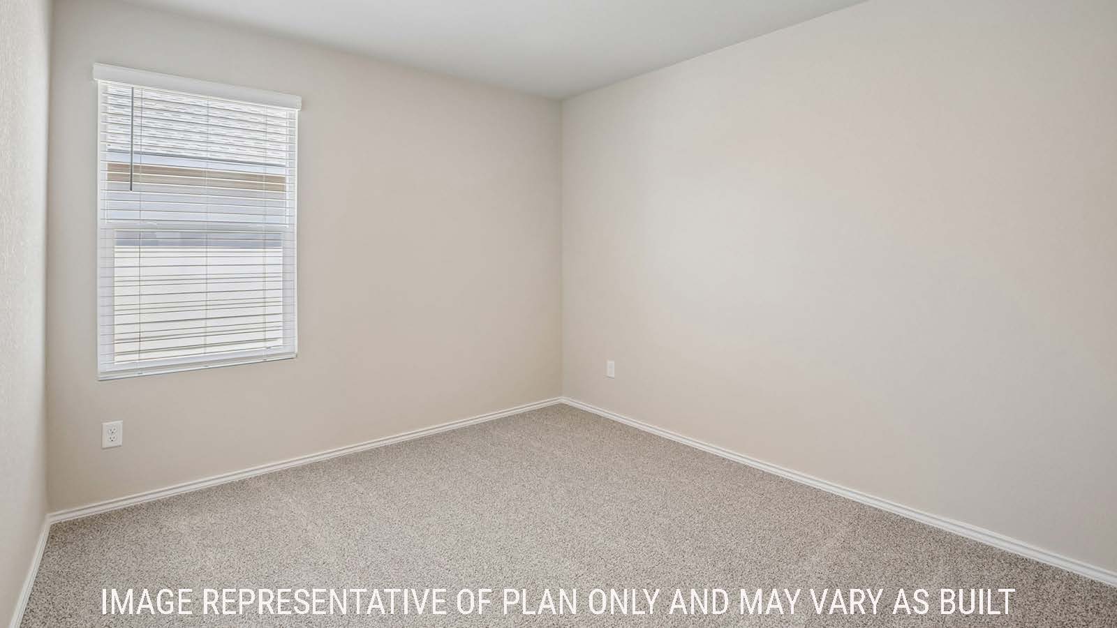 Bradley secondary bedroom with carpeted flooring and window for natural lighting.