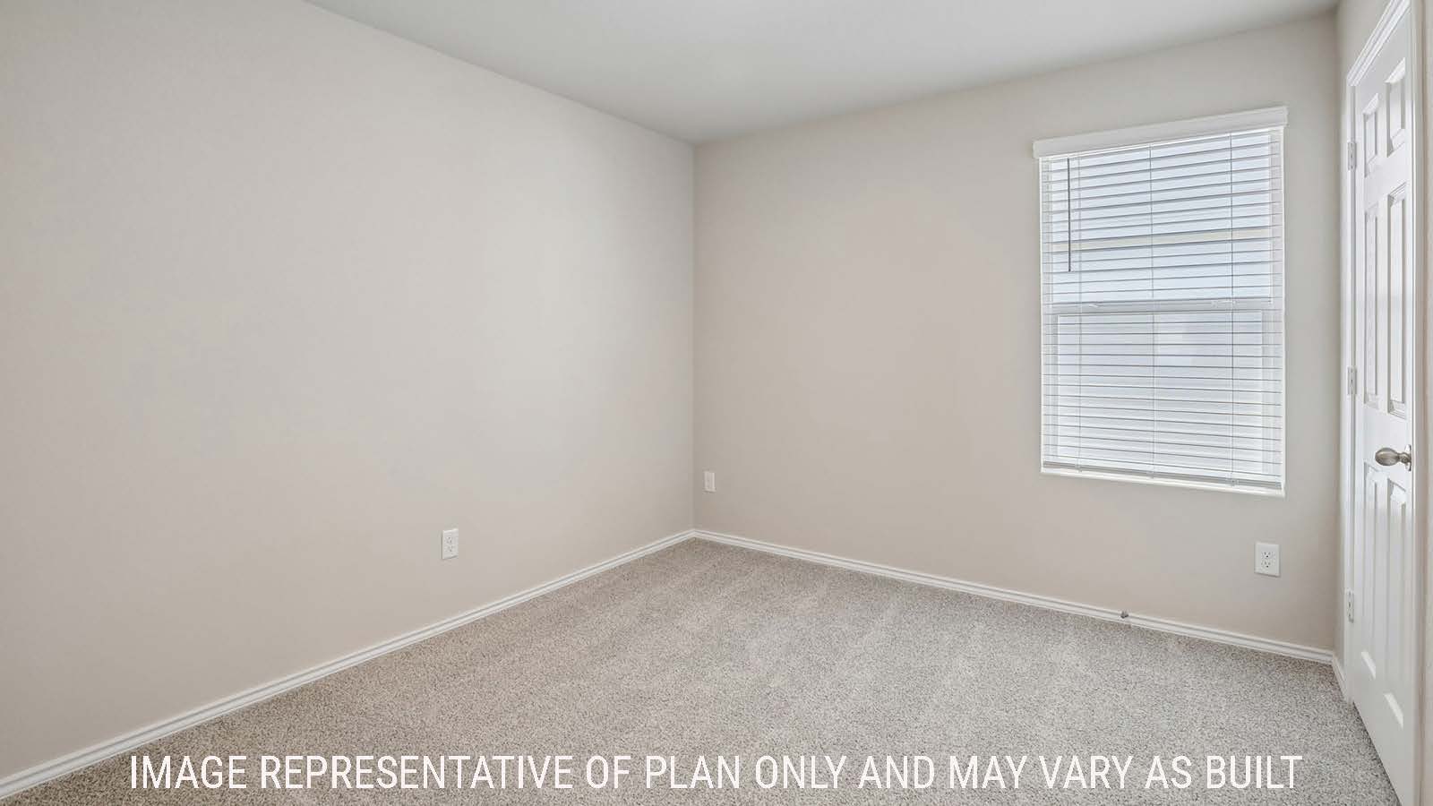 Bradley secondary bedroom with carpeted flooring and window for natural lighting.