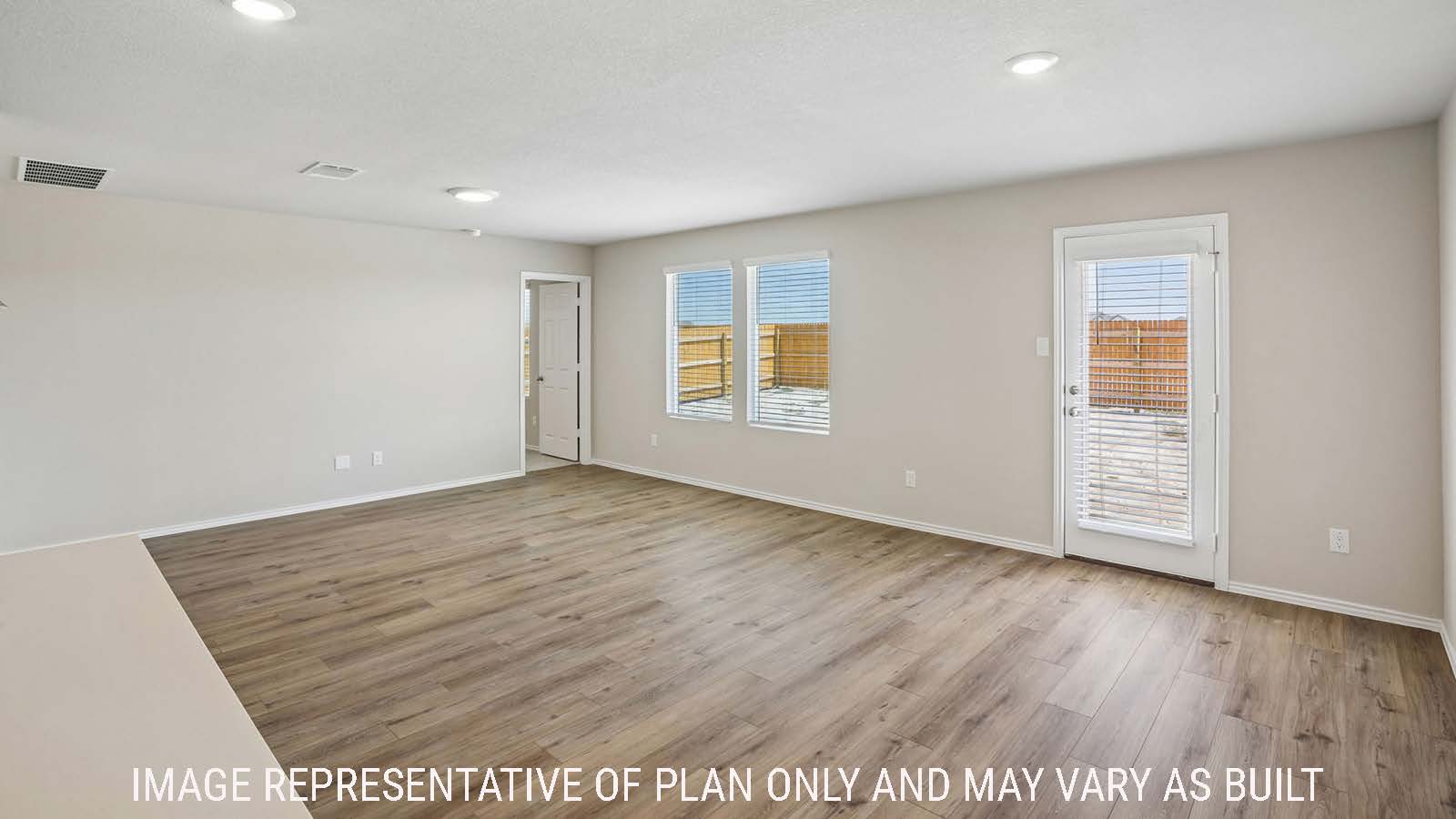 Bradley dining room with windows for natural lighting and view of open concept living room.