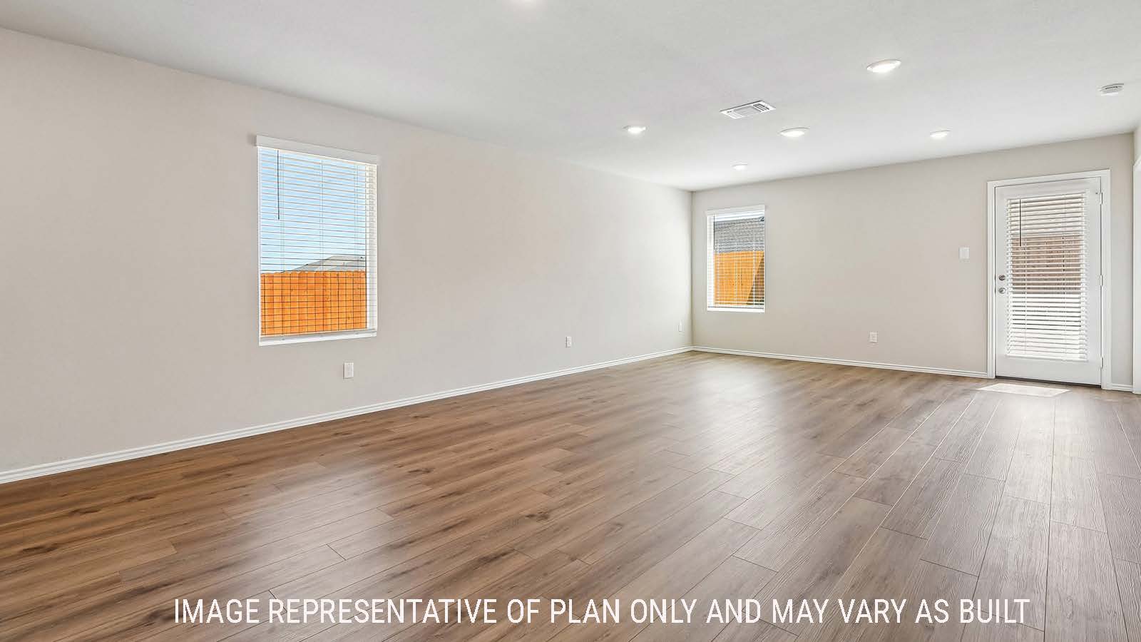 Callahan living room with windows for natural lighting and view of backyard.