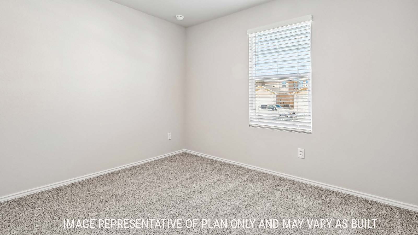 Callahan secondary bedroom with carpeted flooring and window for natural lighting.