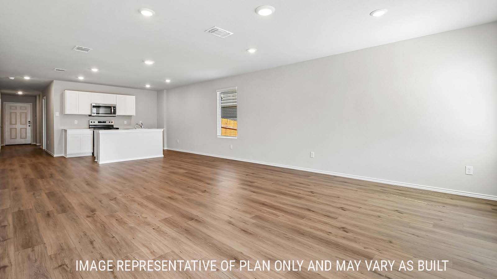Callahan dining room with view of open concept kitchen and hallway to the entry door.