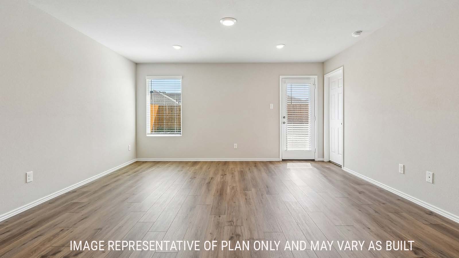 Callahan living room with windows for natural lighting and view of backyard.