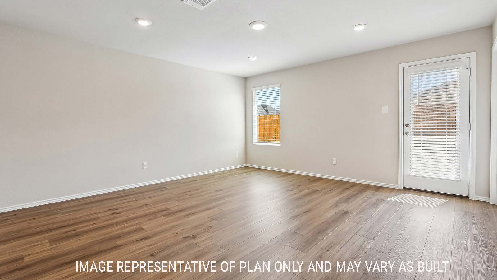 Callahan living room with windows for natural lighting and view of backyard.