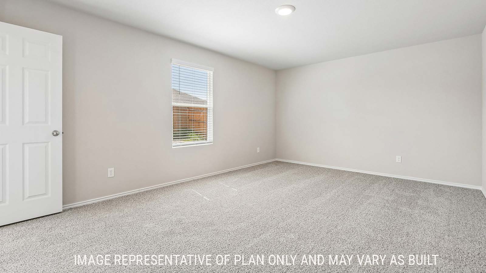 Callahan primary bedroom with carpeted flooring and window for natural lighting.