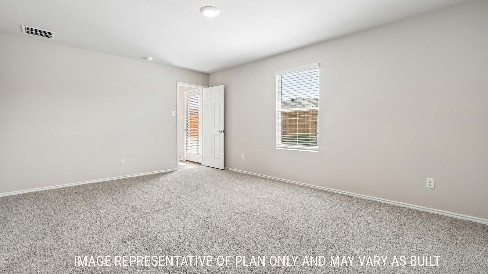 Callahan primary bedroom with carpeted flooring and window for natural lighting.