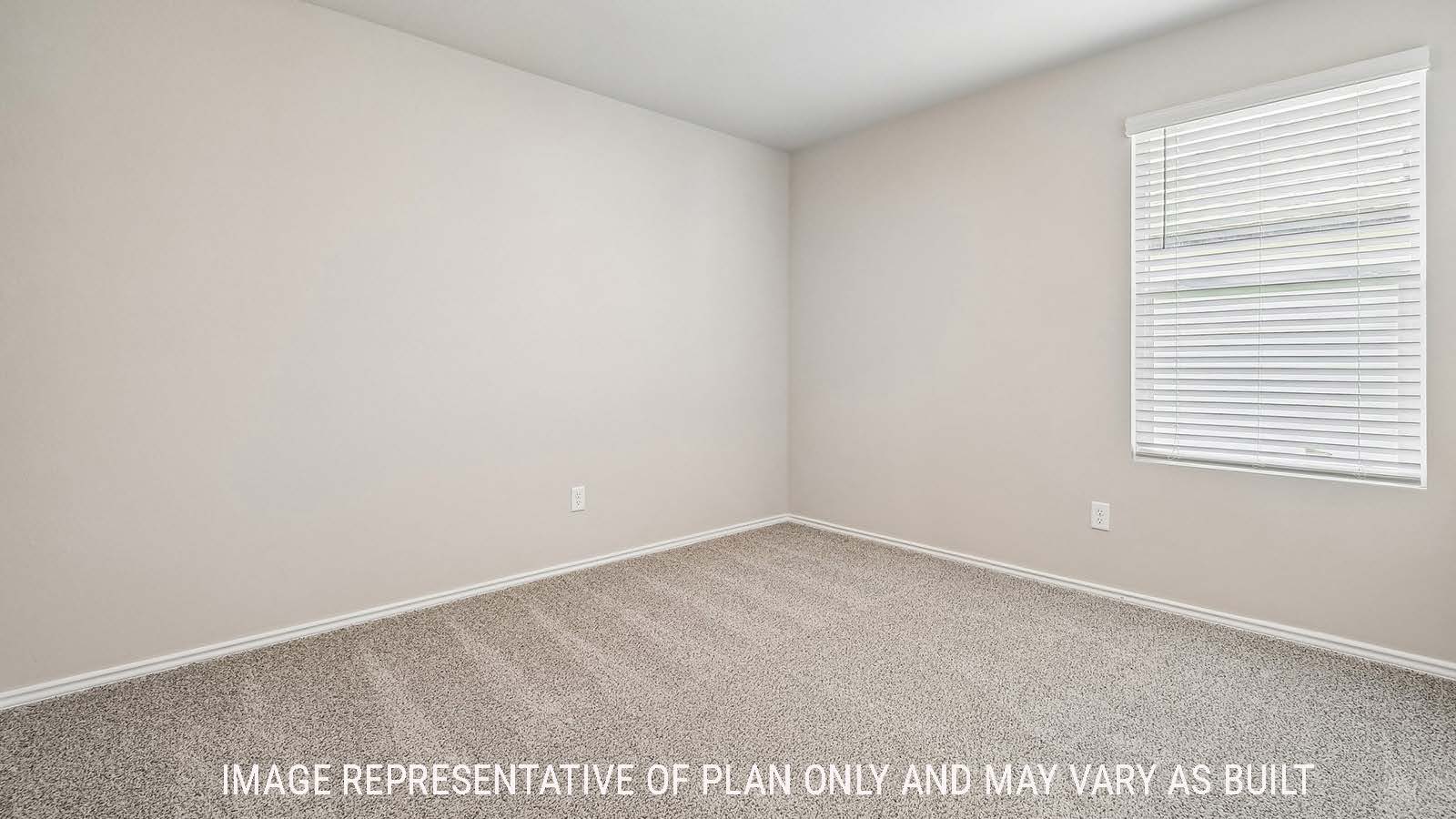 Callahan secondary bedroom with carpeted flooring and window for natural lighting.