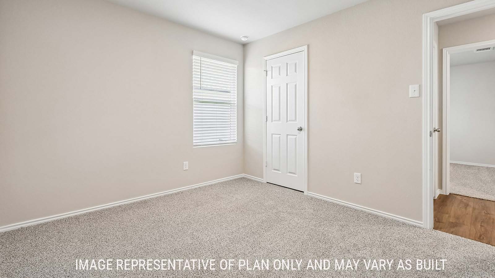 Callahan secondary bedroom with carpeted flooring and window for natural lighting.