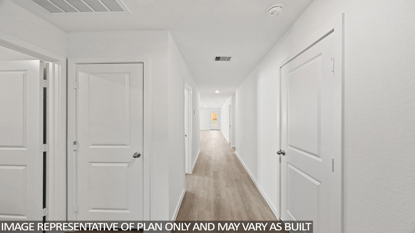 Callahan front hallway with vinyl plank flooring and view of living room.