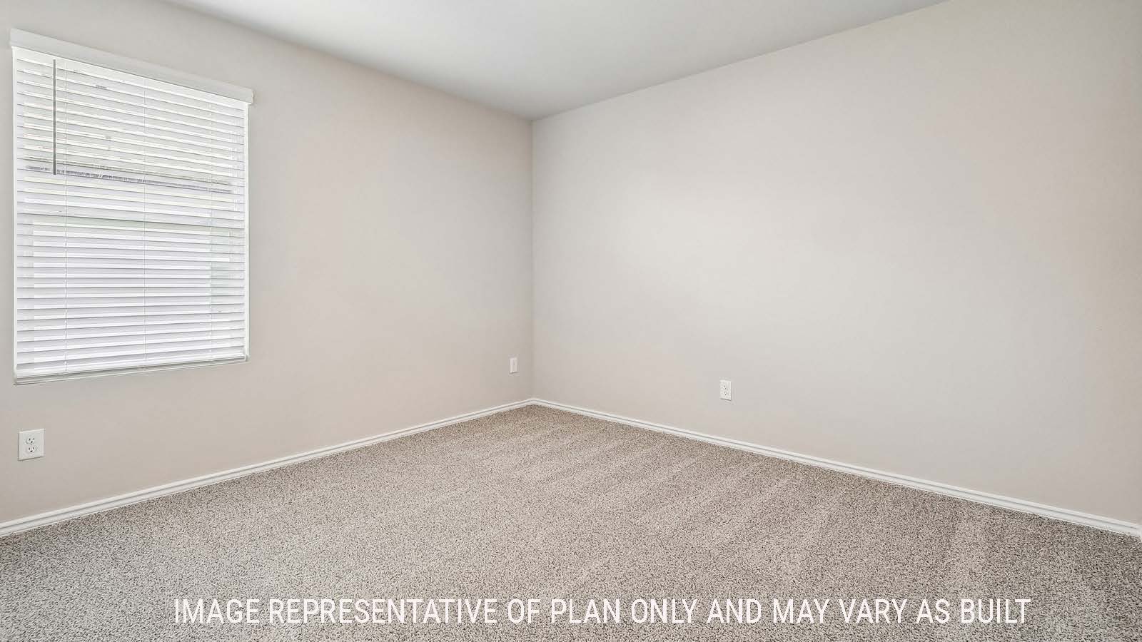 Callahan secondary bedroom with carpeted flooring and window for natural lighting.