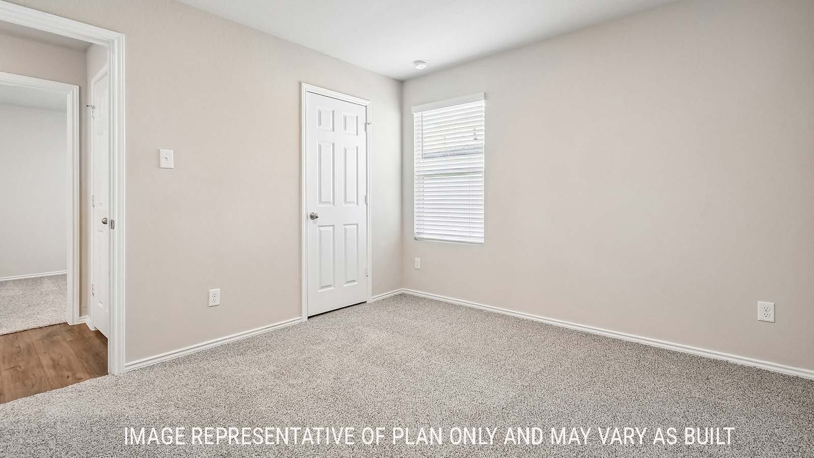 Callahan secondary bedroom with carpeted flooring and window for natural lighting.