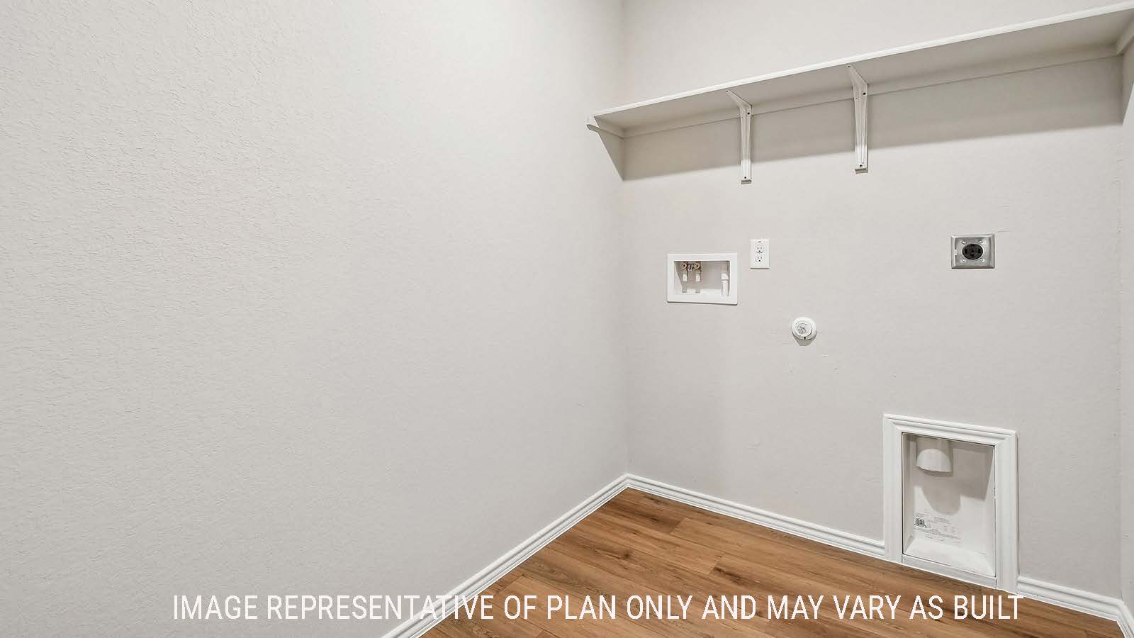 Callahan utility room with washer and dryer connections with shelving for storage.