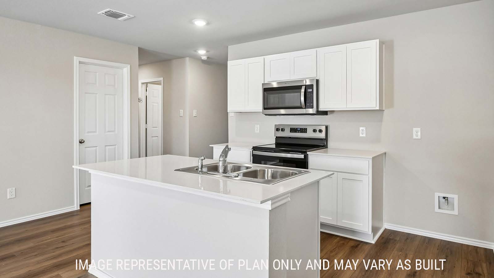 Callahan kitchen with kitchen island  with light cabinets and granite countertops.