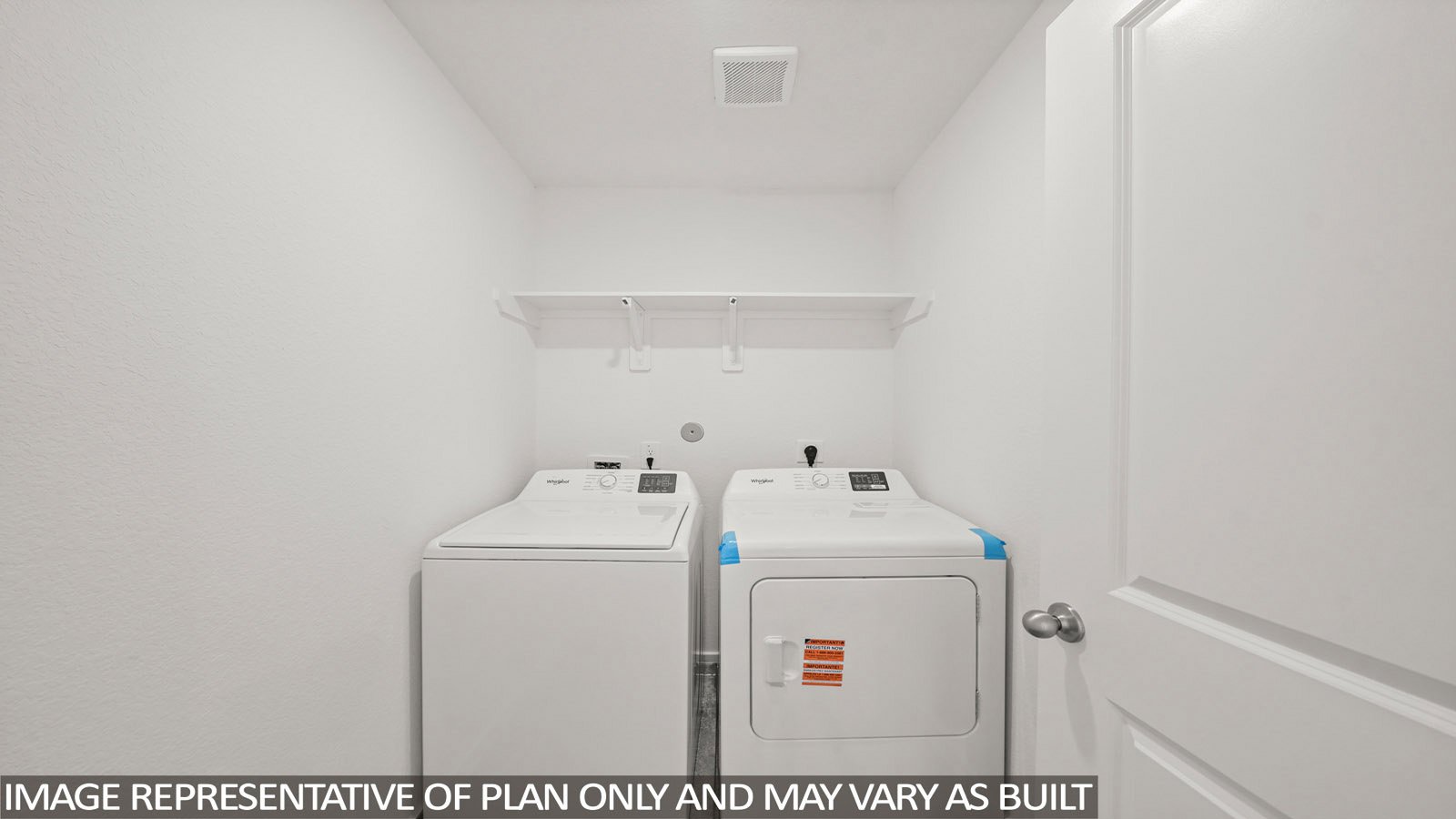 Dawson utility room with washer and dryer and shelving for storage.