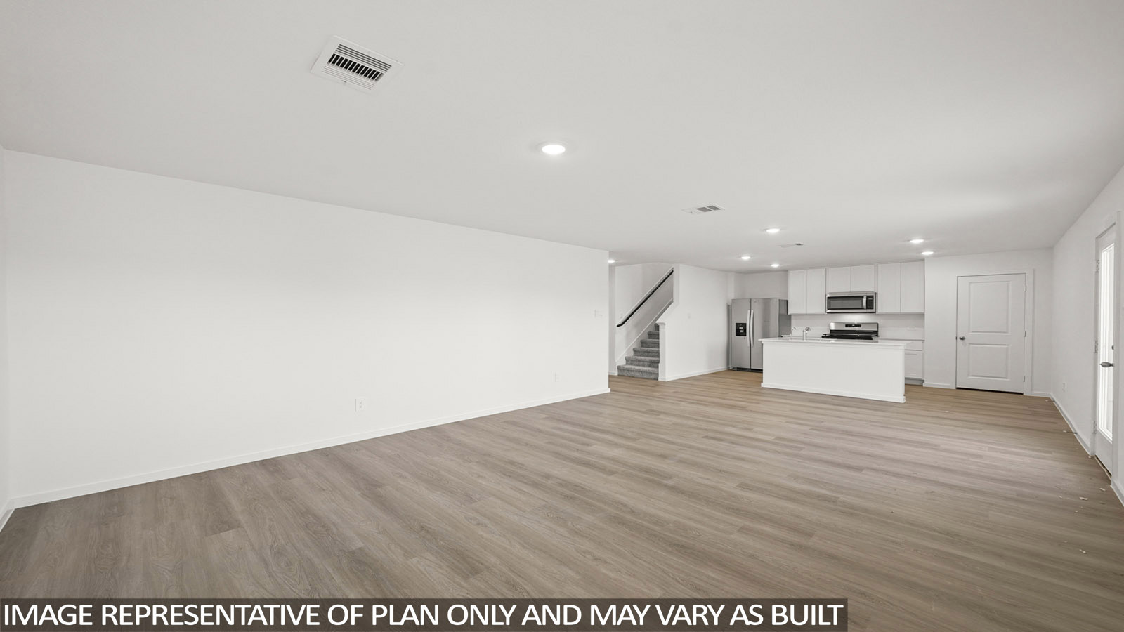 Dawson living room with vinyl plank flooring with view of open-concept dining room and kitchen.