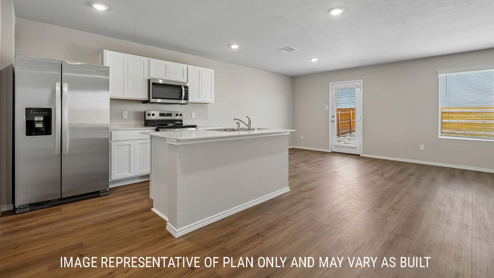 Austin kitchen with kitchen island and view of open concept dining room.