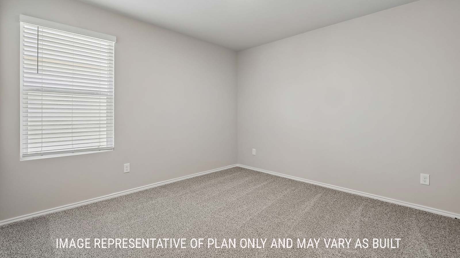 Austin secondary bedroom with carpeted flooring and window for natural lighting.