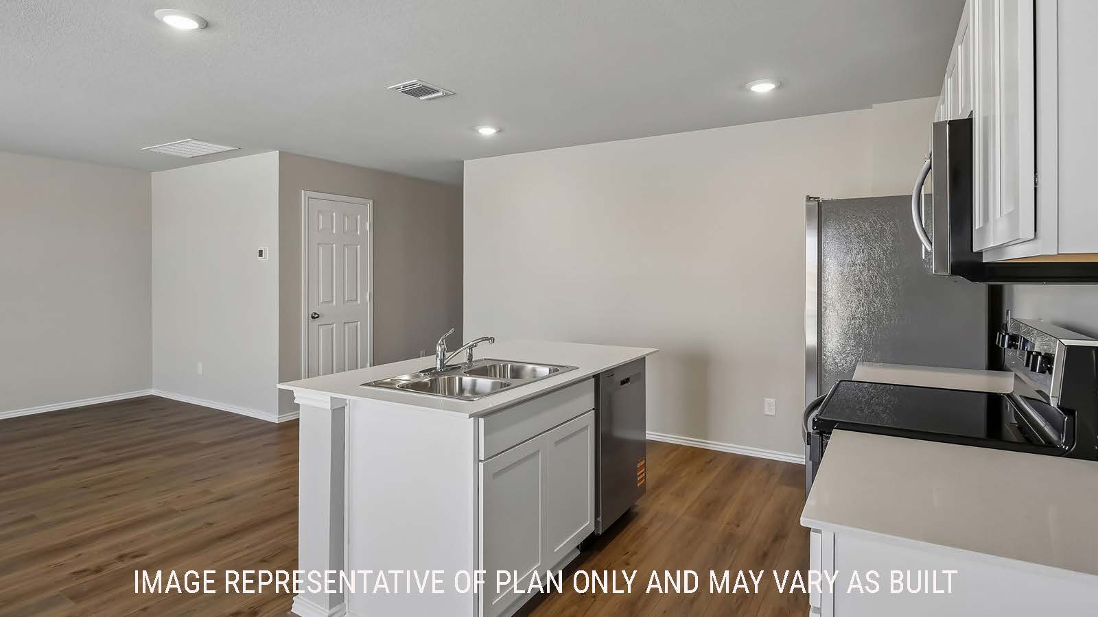 Austin kitchen with kitchen island and light cabinets and granite countertops.