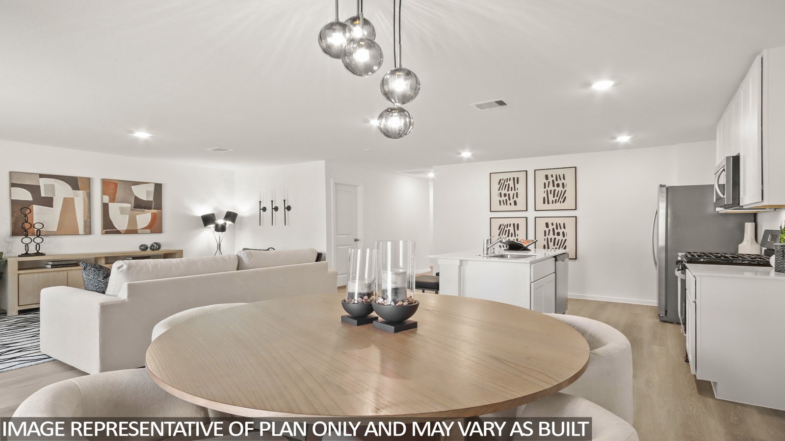 Austin dining room with vinyl plank flooring and view of open-concept living room and kitchen.