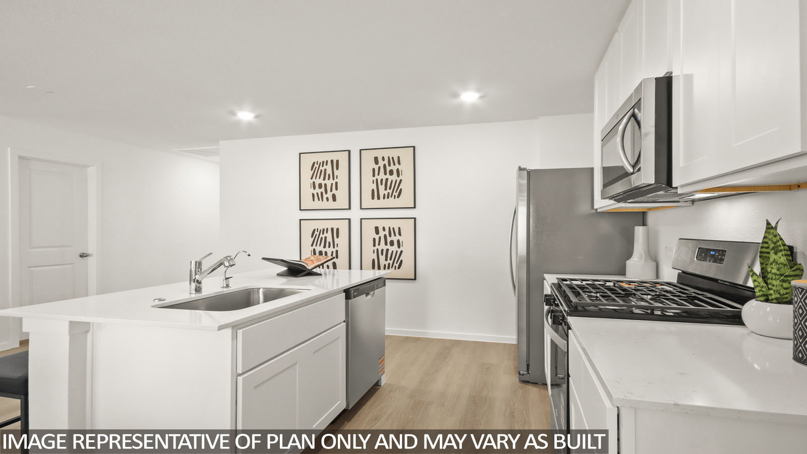 Austin kitchen with kitchen island and white cabinets and light countertops.