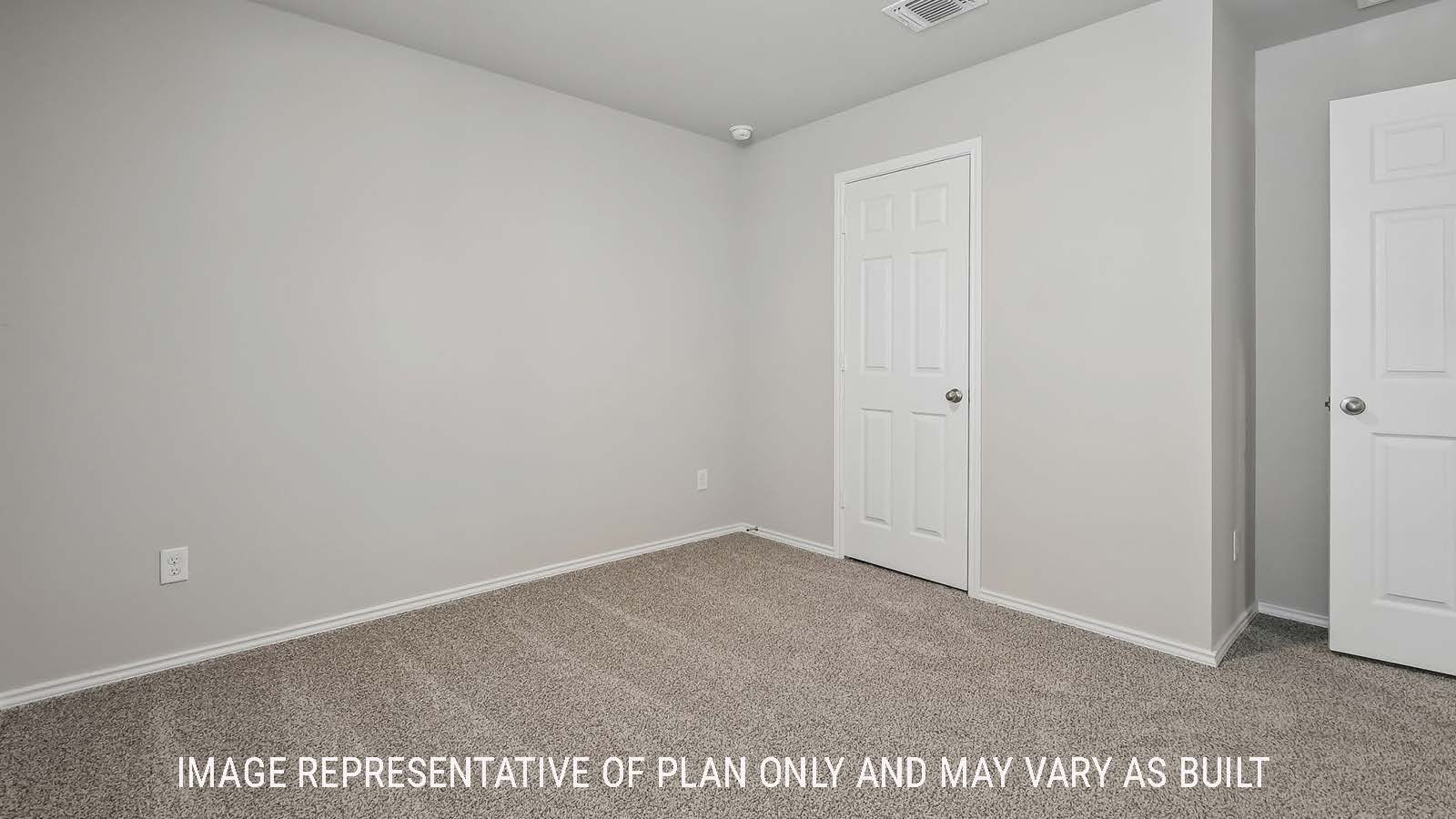 Austin secondary bedroom with carpeted flooring and view of closet door.