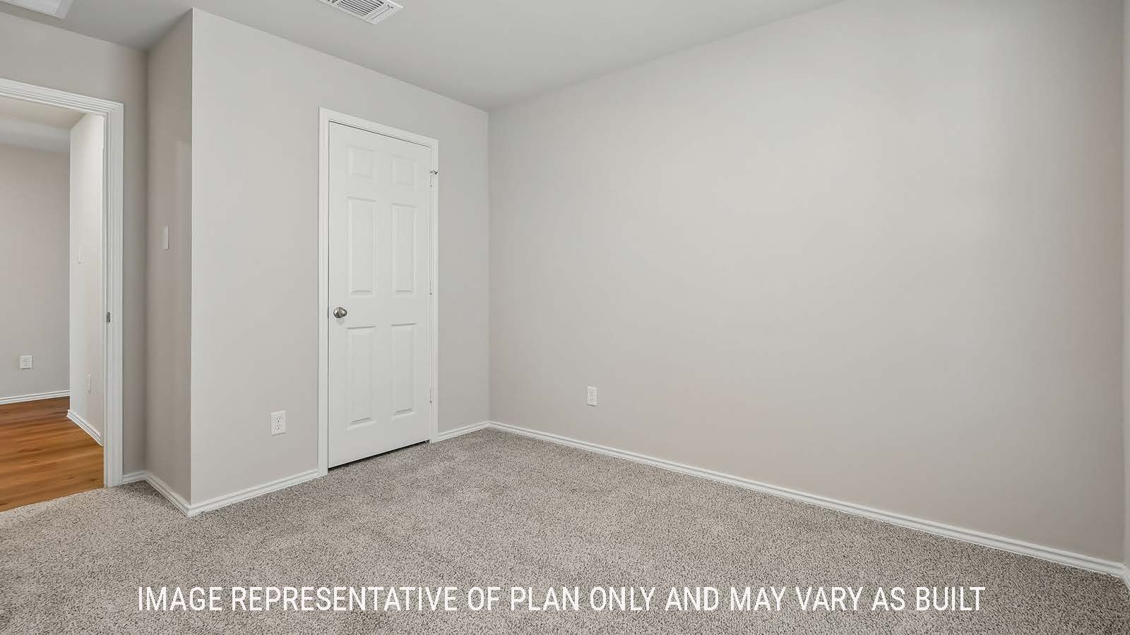 Austin secondary bedroom with carpeted flooring and view of closet door.