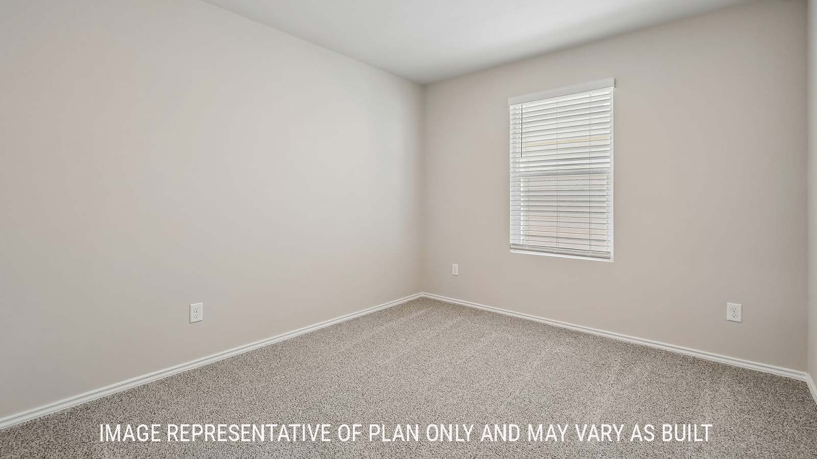Austin secondary bedroom with carpeted flooring and window for natural lighting.