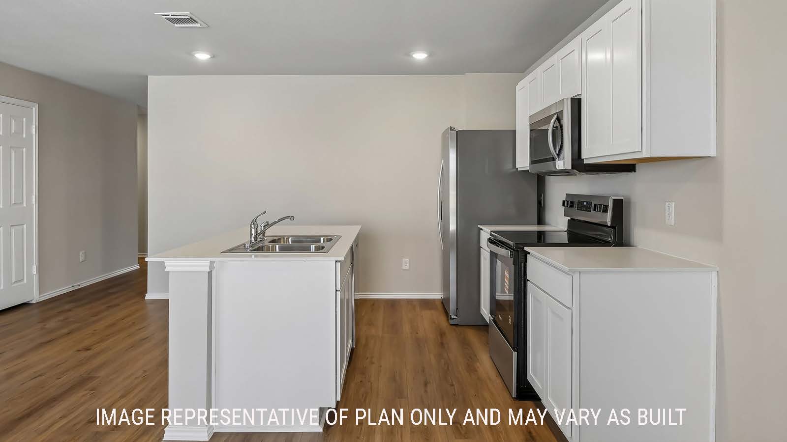 Austin kitchen with kitchen island and light cabinets and granite countertops.