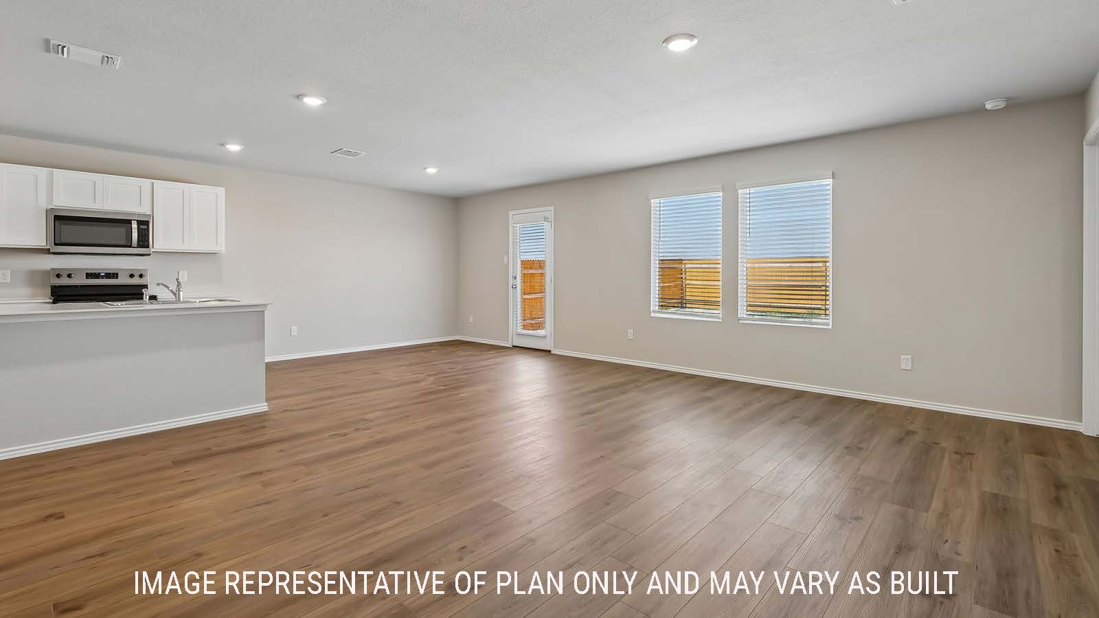 Austin dining room with view of kitchen and backdoor to the back yard.